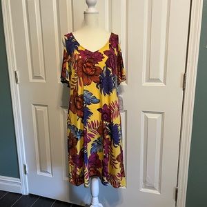 Yellow,Palm and flower , cut out sleeves dress. Never worn , but no tags .